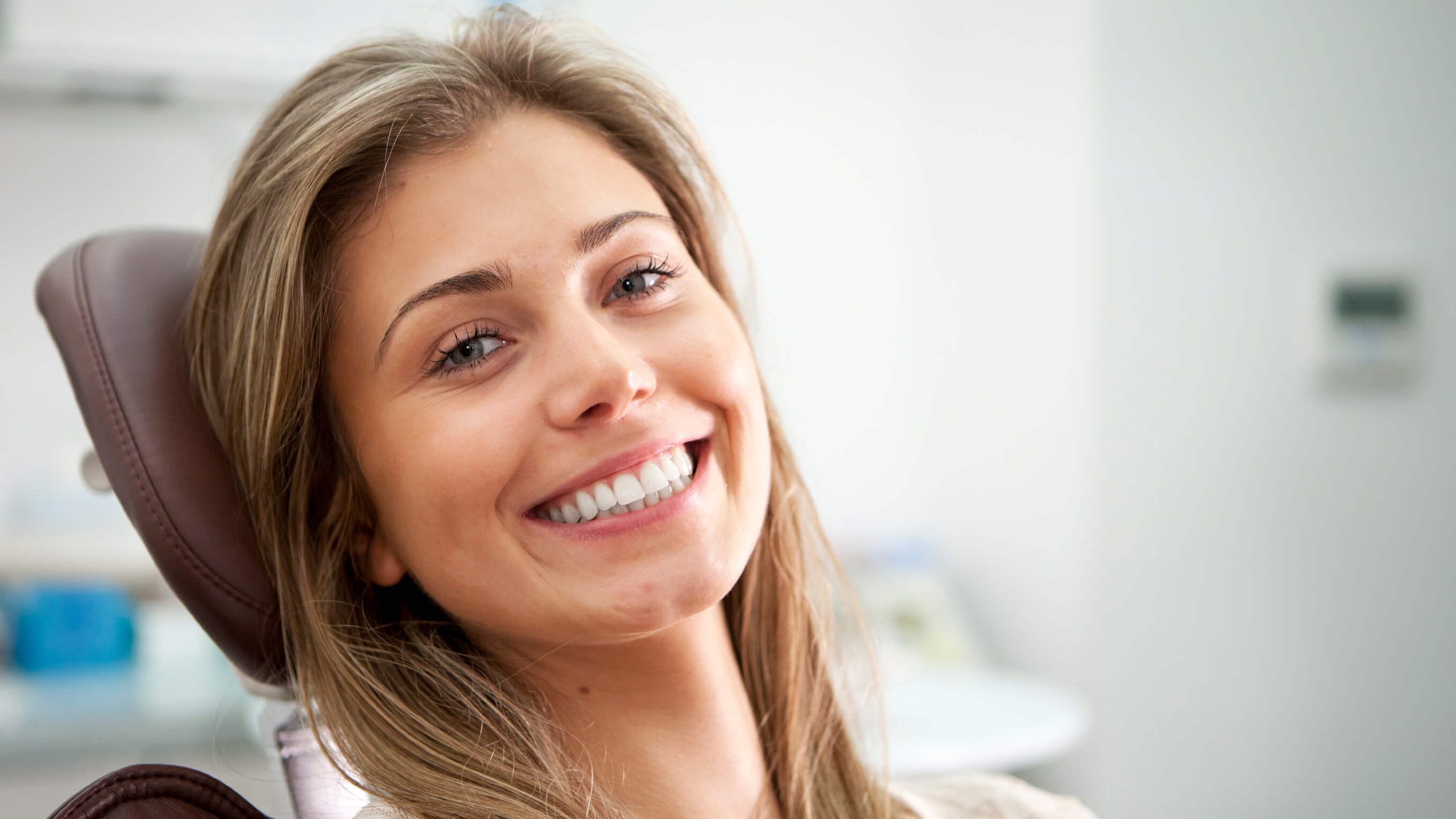 woman in dental chair smiling